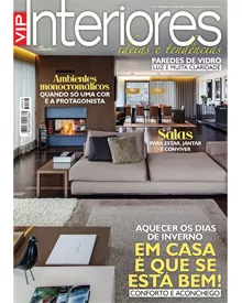 Press clipping: The cover of VIP Interiores magazine, featuring a modern living room with a fireplace.