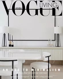 Vogue Living Arabia cover featuring a minimalist white dining area with clean lines and modern furniture.
