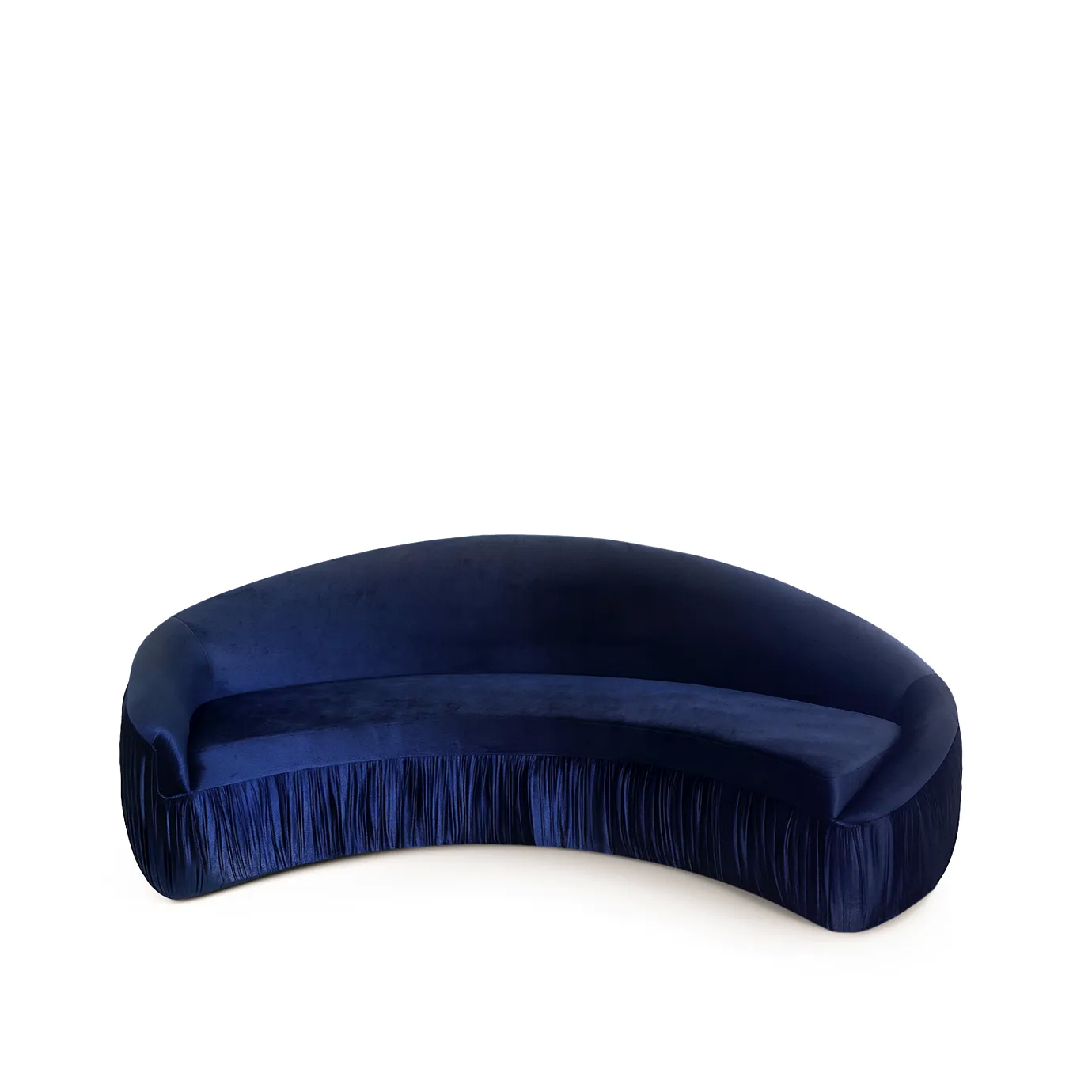 Vamp Full Upholstery Sofa in curved navy blue velvet with fringe detail, featuring a smooth rounded back and seat in a luxurious, modern interior setting.