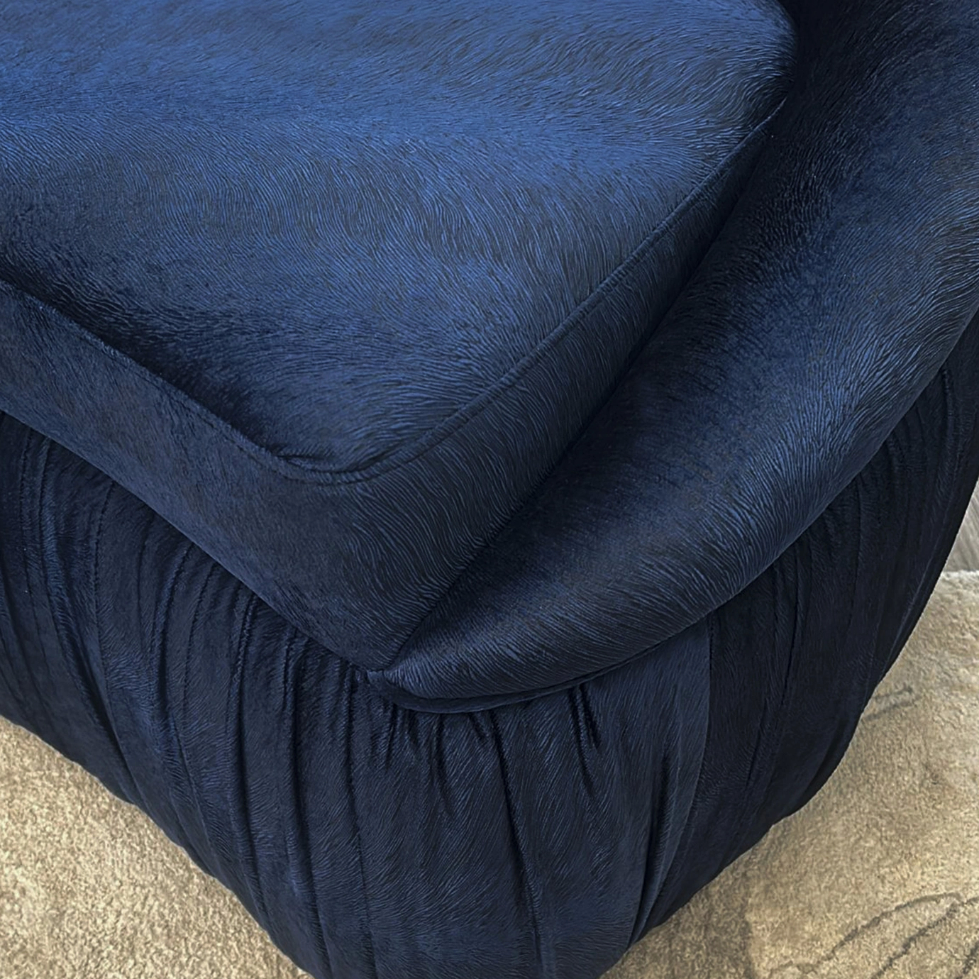 Vamp Full Upholstery Sofa in curved navy blue velvet with fringe detail, featuring a smooth rounded back and seat in a luxurious, modern interior setting.