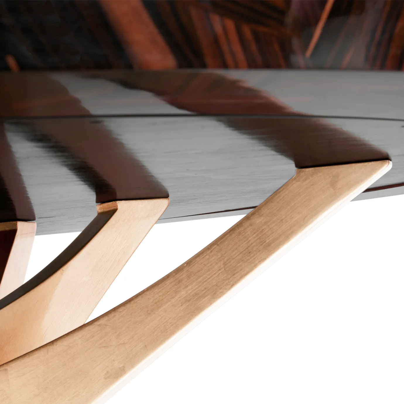 Patch Dining Table with geometric wood veneer top and sculptural oak base, finished in high gloss.
