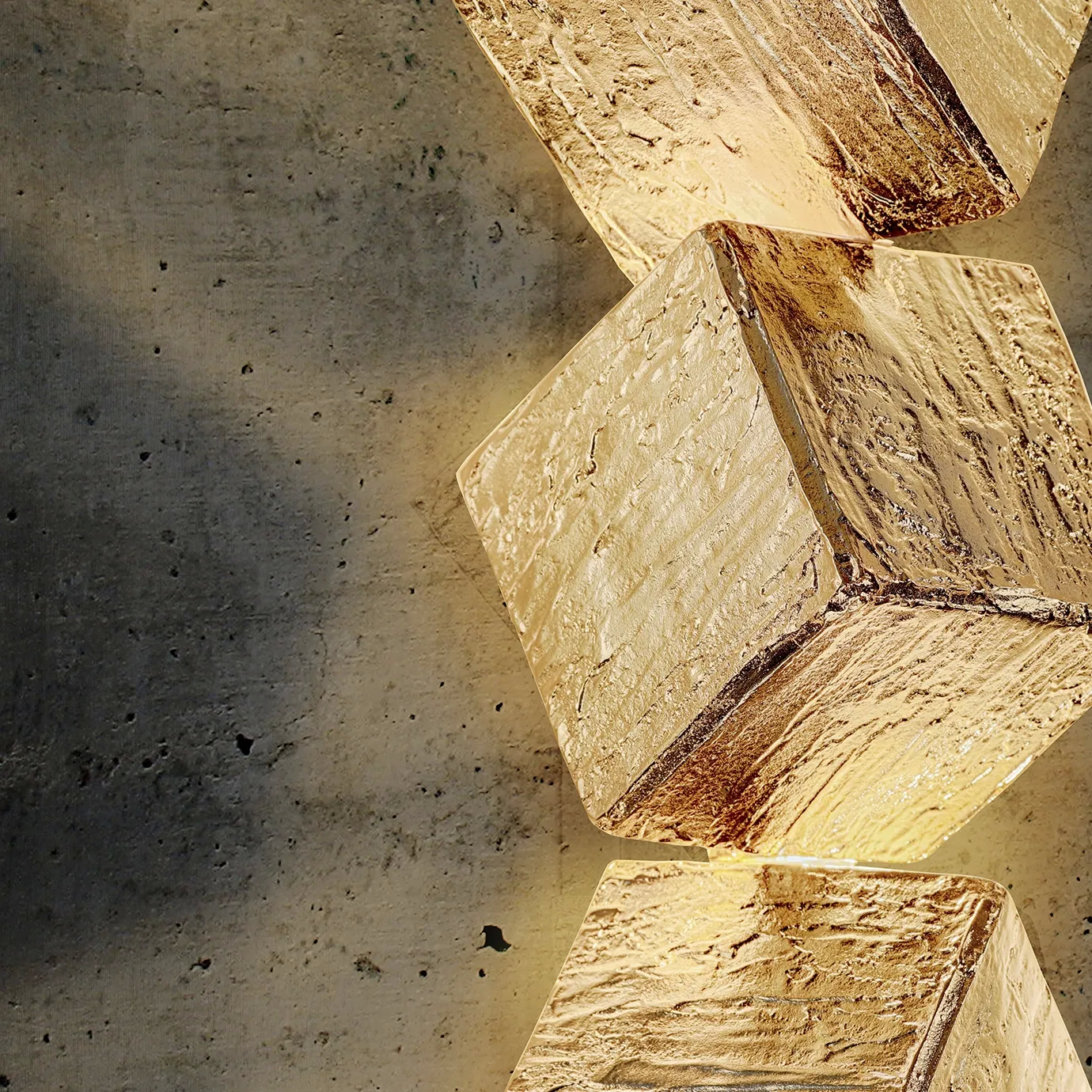 Close-up detail of the Cubic Big Sconce, highlighting its sharp edges, textured metal finish, and minimalist design for modern, statement lighting