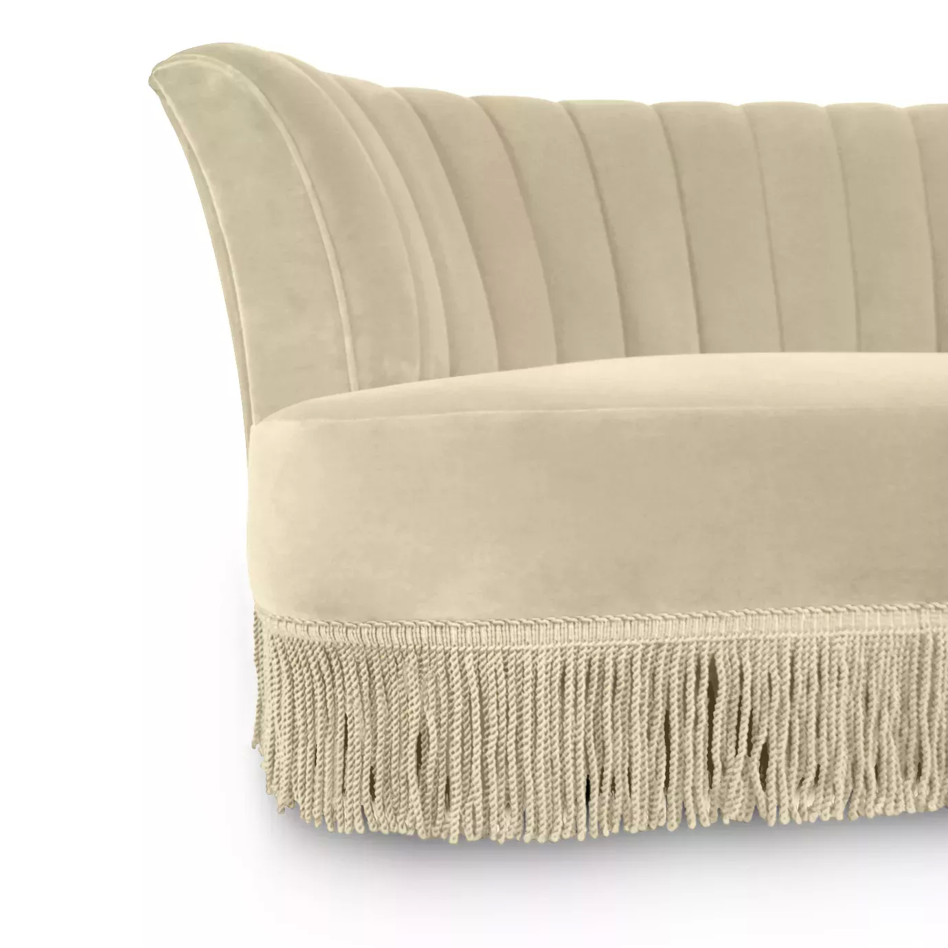 Elegant close-up of the cream fabric upholstery, the pleated details of the backrest, and the long fringe at the base of the Sevilliana Sofa.