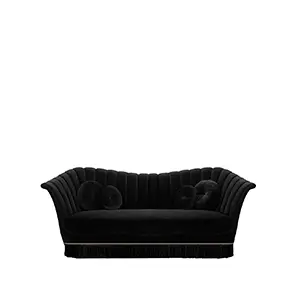 Elegant Caprichosa Fully Upholstered Sofa in black velvet with pleated details, matching round cushions, and a black fringe with golden accents at the base.