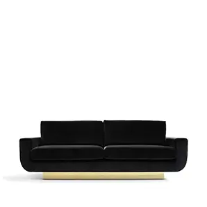 A luxurious Sofia Sofa by Koket features a sleek, low-profile design upholstered in rich black velvet, elevated by a striking gold base.