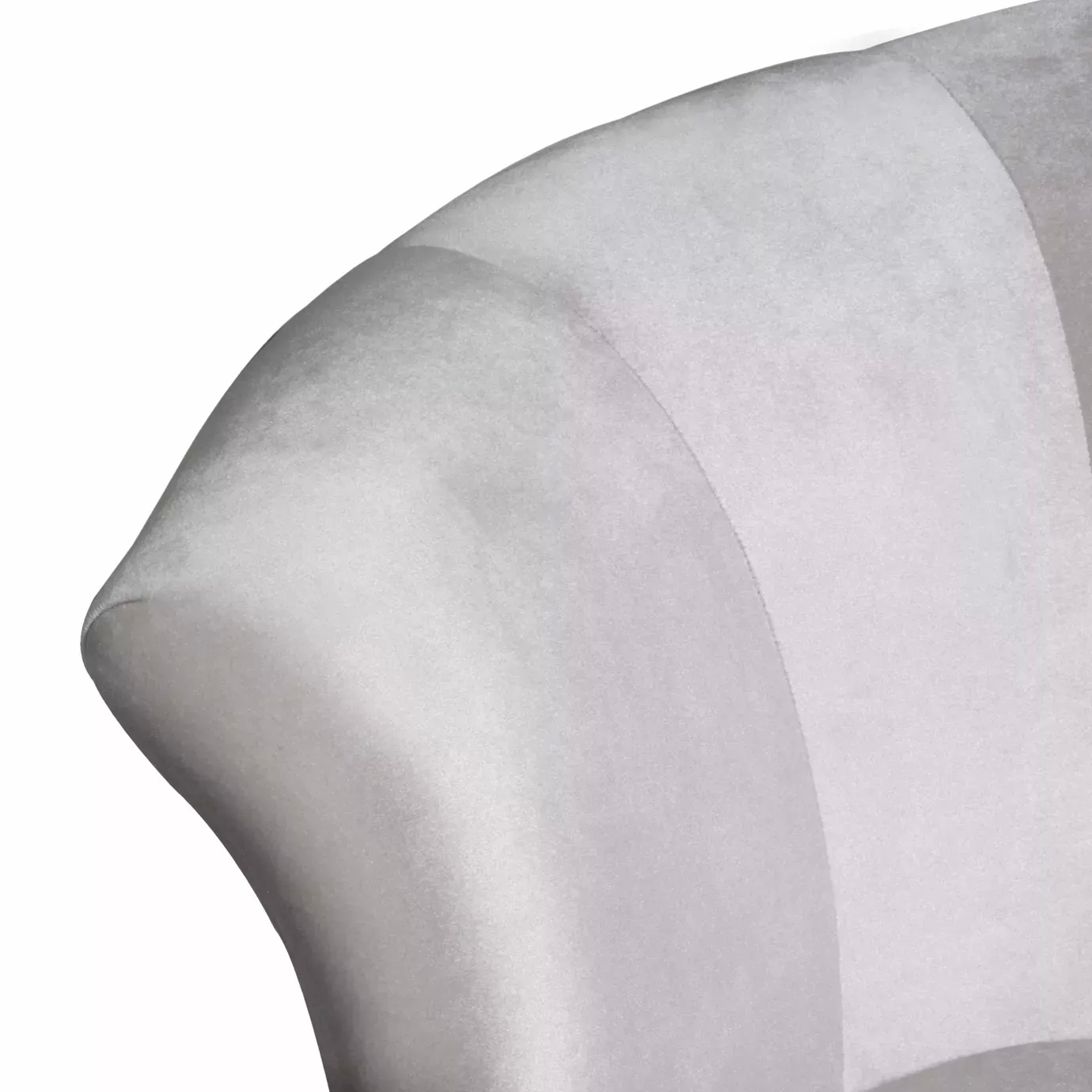 Elegant close-up of the armrest and the white fabric upholstery with pleated details of the Besame Sofa.