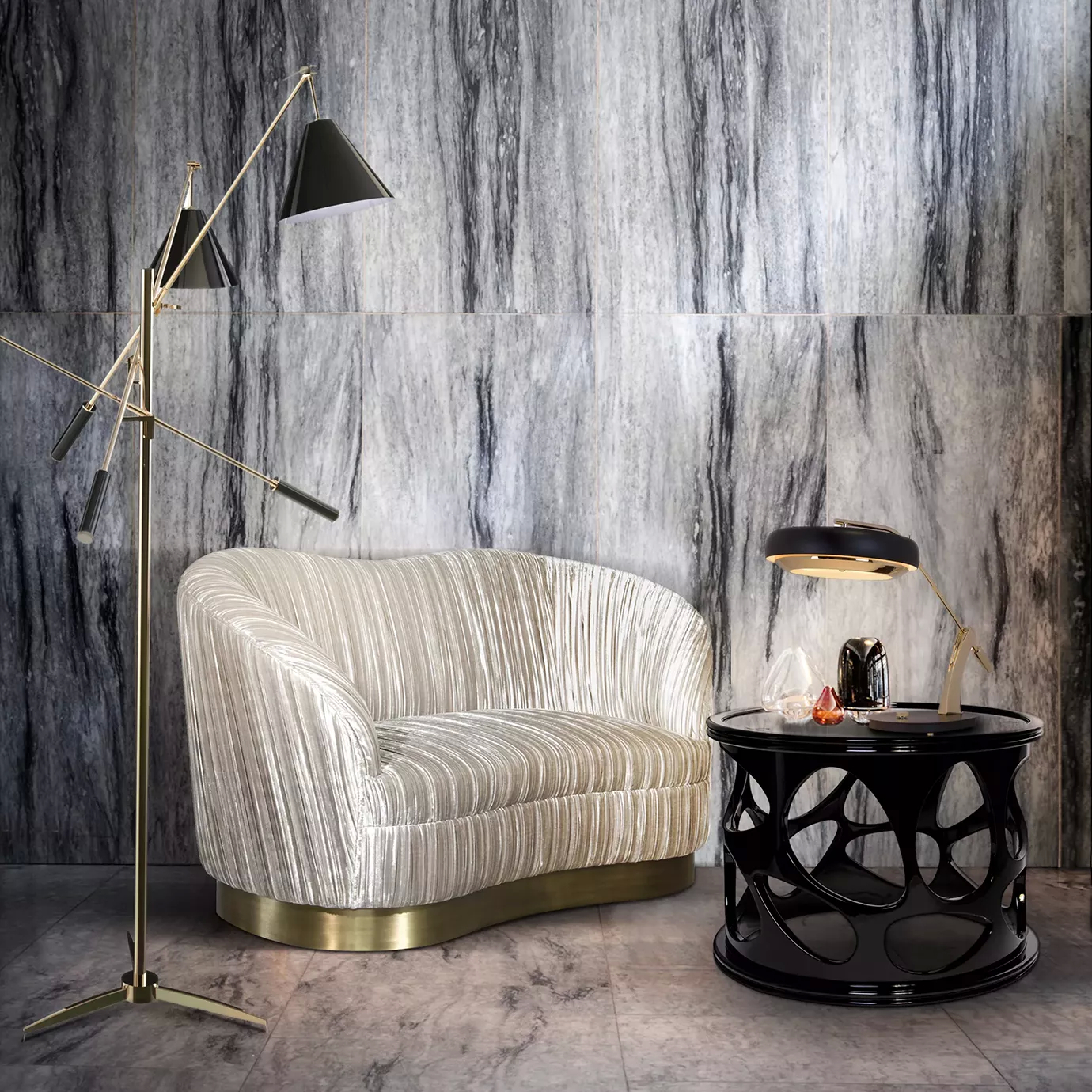 Elegant reading corner with the Kelly Loveseat featuring a golden metal base and textured beige fabric upholstery with pleated details