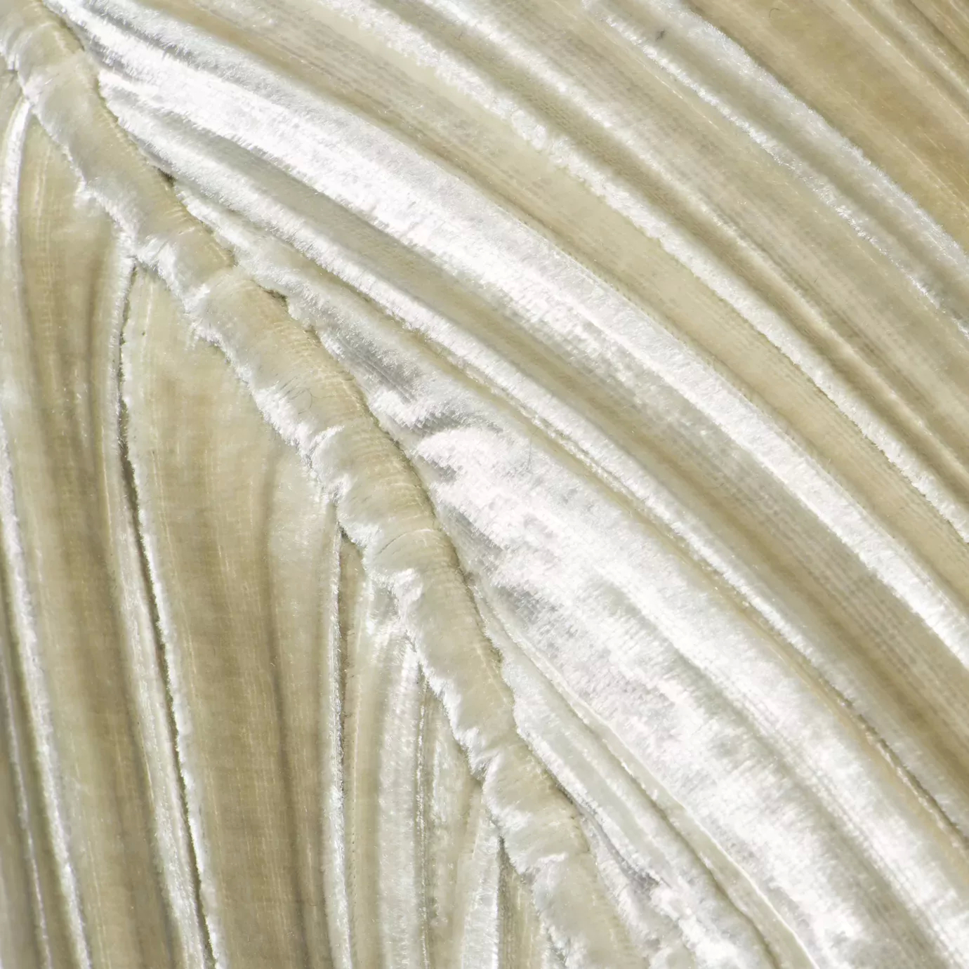 Elegant close-up of the pleated detail of the textured beige fabric of the Kelly Loveseat.
