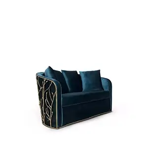 Side view of the Enchanted Sofa, showcasing its intricate aged brass structure resembling branches, contrasting with the elegant dark green upholstery and pillows.