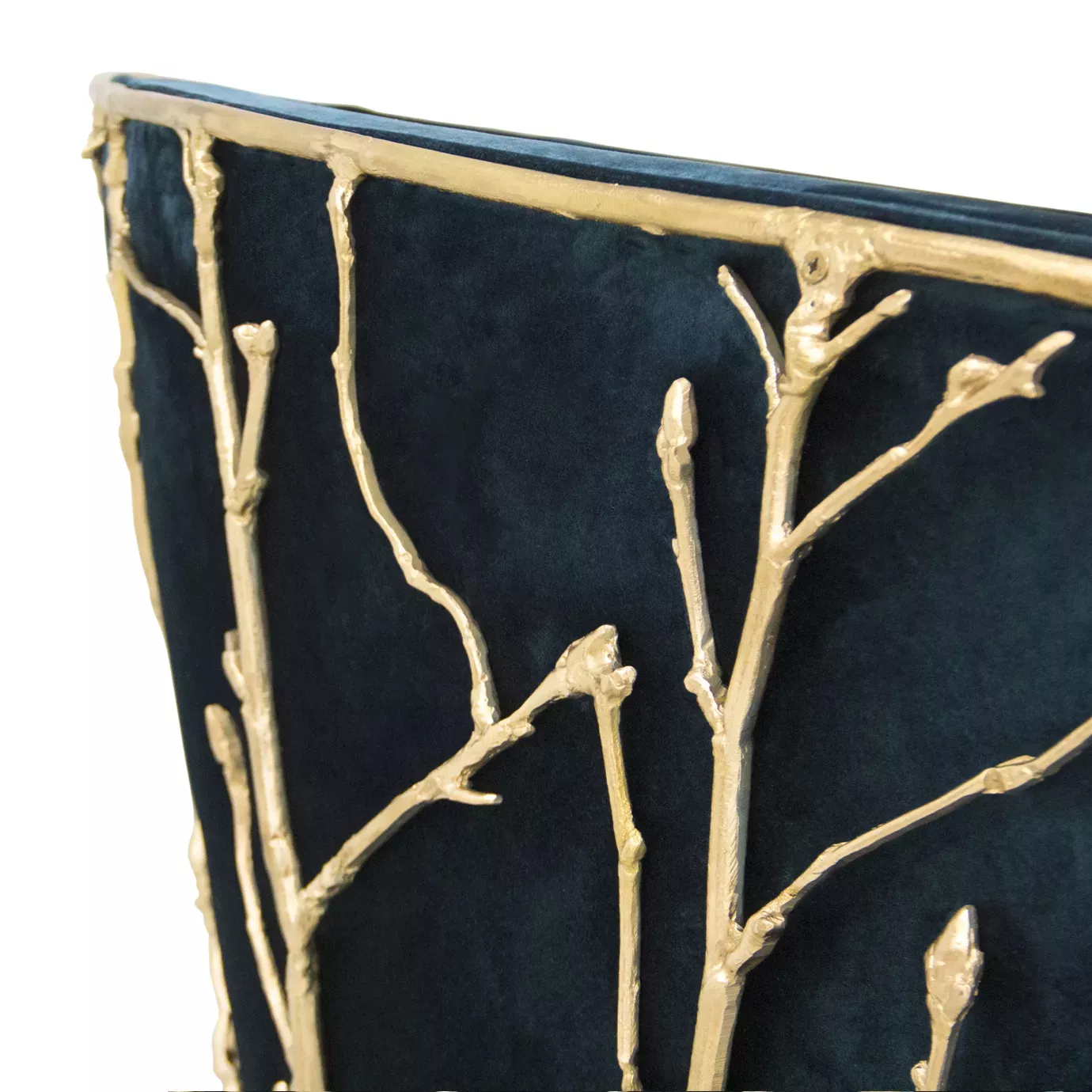 Detailed view of the Enchanted Sofa, highlighting its intricate aged brass structure resembling branches, contrasting with the elegant dark green upholstery.