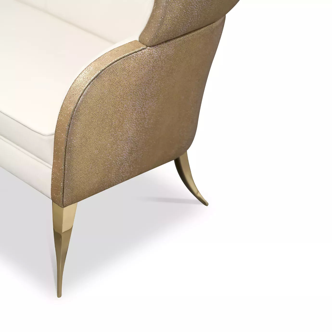 Elegant close-up of the golden textured leather outer structure and the golden metal legs of the Drapesse Sofa.
