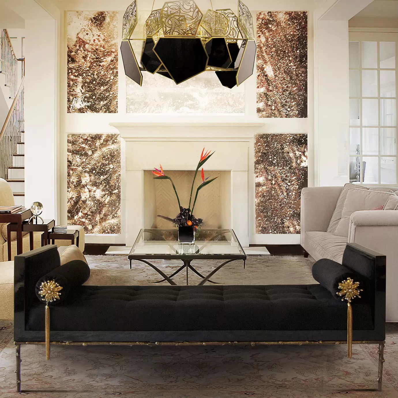Elegant living room with the Privê Daybed in black velvet and golden details under a modern chandelier and over a glass coffee table.