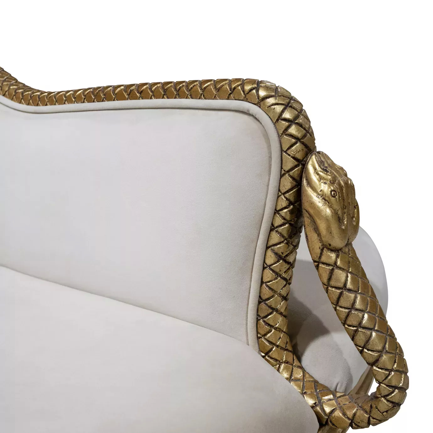 Elegant close-up of the snake-shaped golden frame detail and light fabric upholstery of the Mistress Confidante.