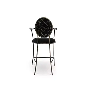 Showcasing its intricate aged brass frame that resembles branches, the Enchanted Bar Stool features a glamourous black upholstery.