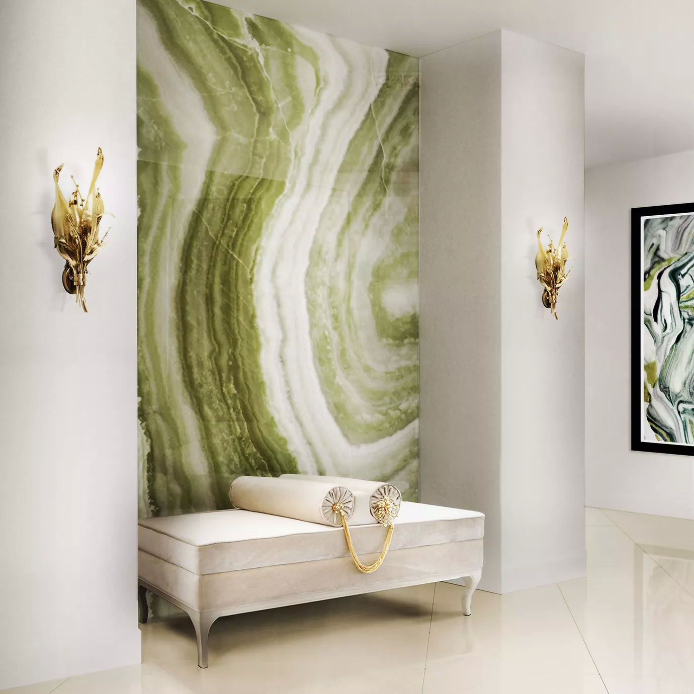 Elegant hallway with the Lé Lé Bench in light velvet and golden details, placed against a green onyx wall and illuminated by sculptural golden sconces.