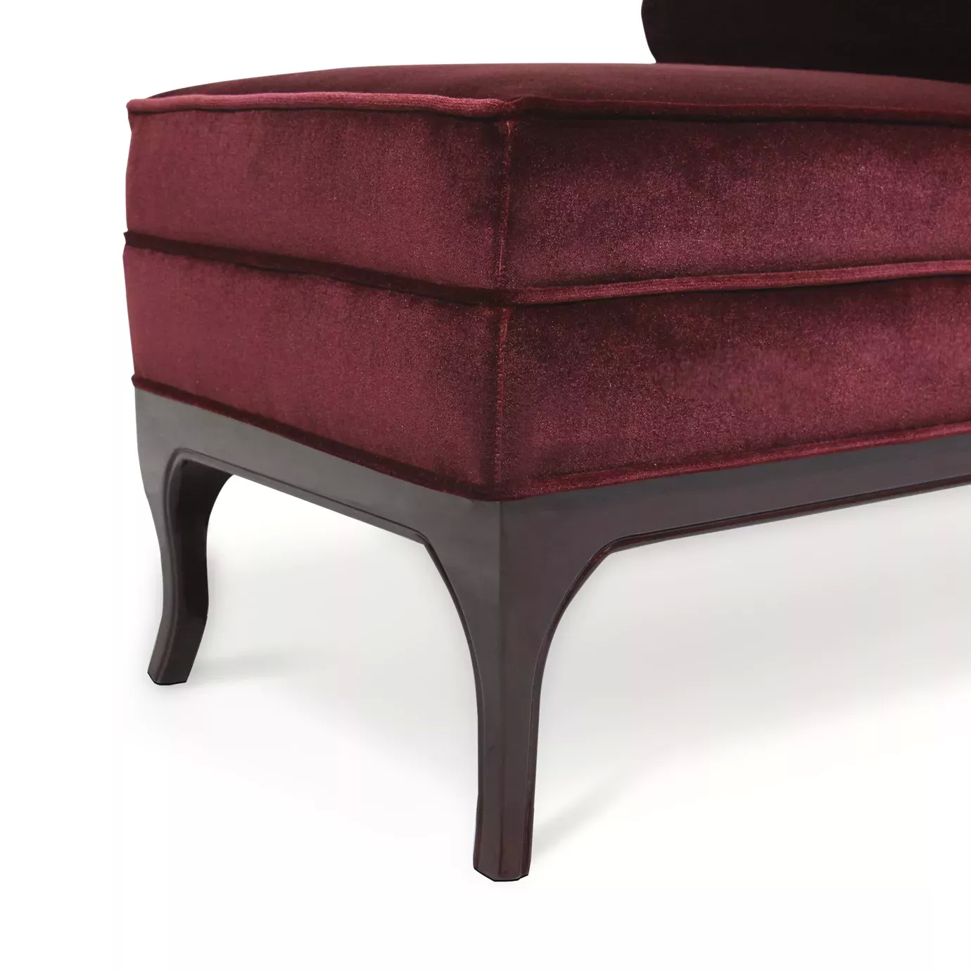 Elegant close-up of the burgundy velvet upholstery and dark frame of the Lé Lé Bench.