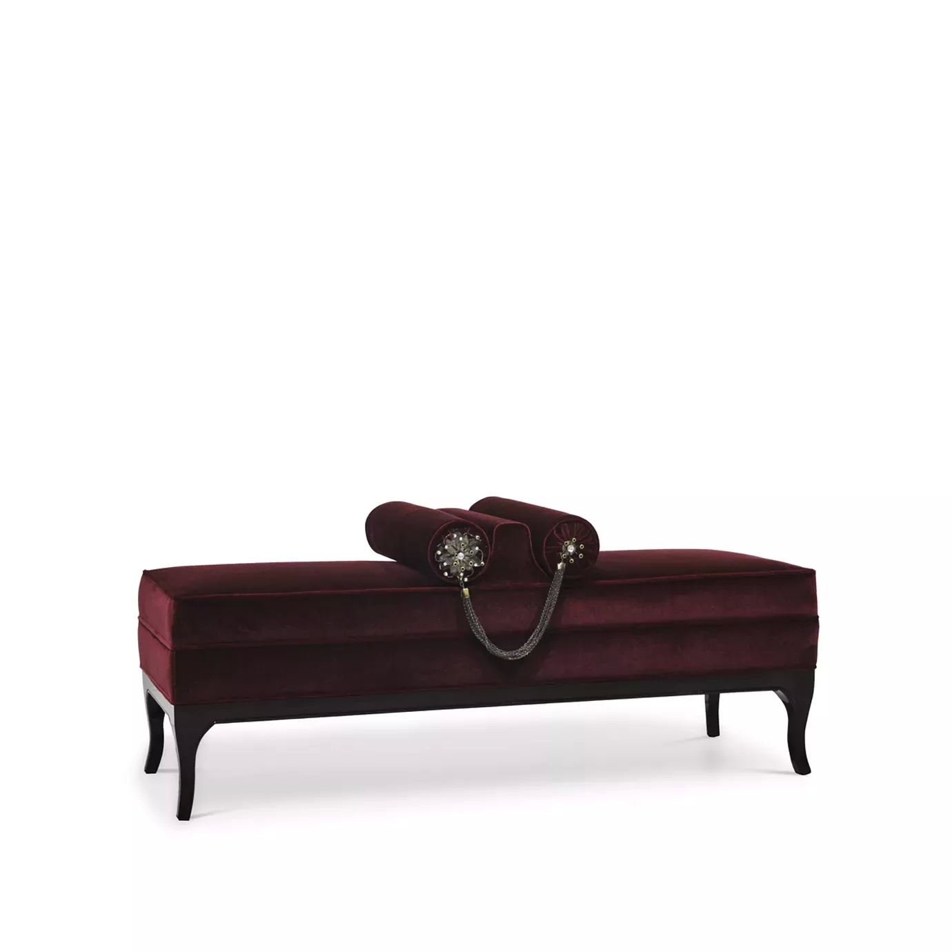 Elegant Lé Lé Bench with burgundy velvet upholstery, dark frame, and decorative cylindrical pillows with golden details and chains.