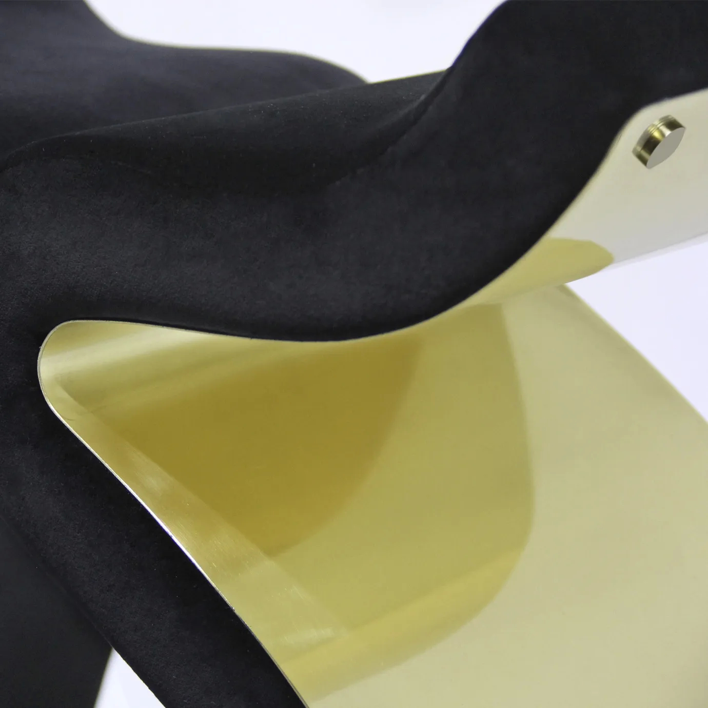 Elegant close-up of the black velvet upholstery detail and sculptural golden frame of the Bolvardi Bench.