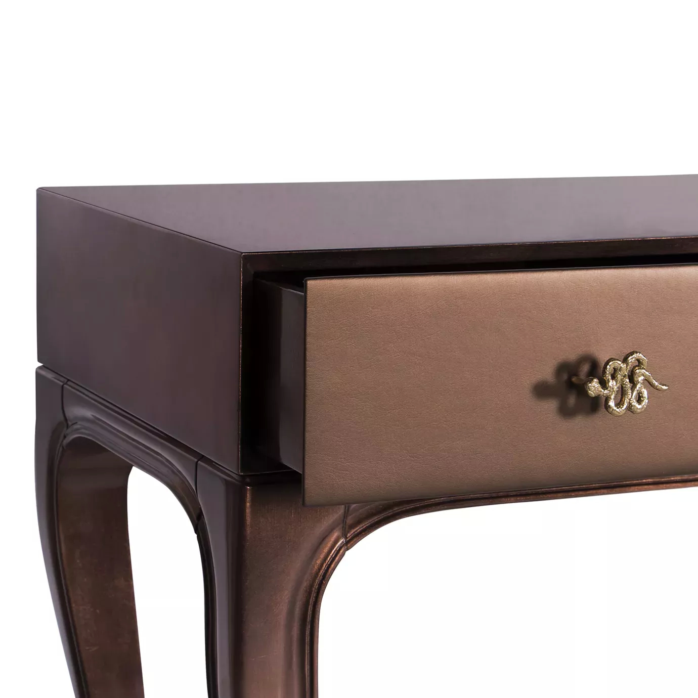 Close-up of the open drawer of the Untamed Console with golden snake handle.