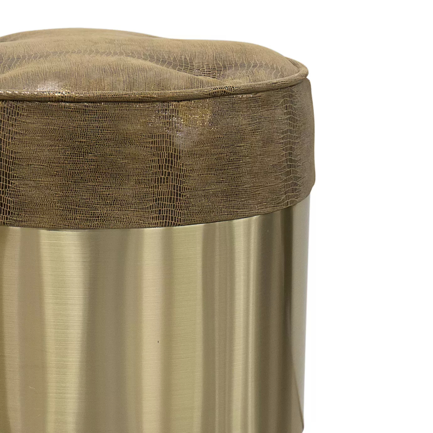 Elegant close-up of the round textured leather seat detail in golden tones and the golden band of the Olivia Stool's base.