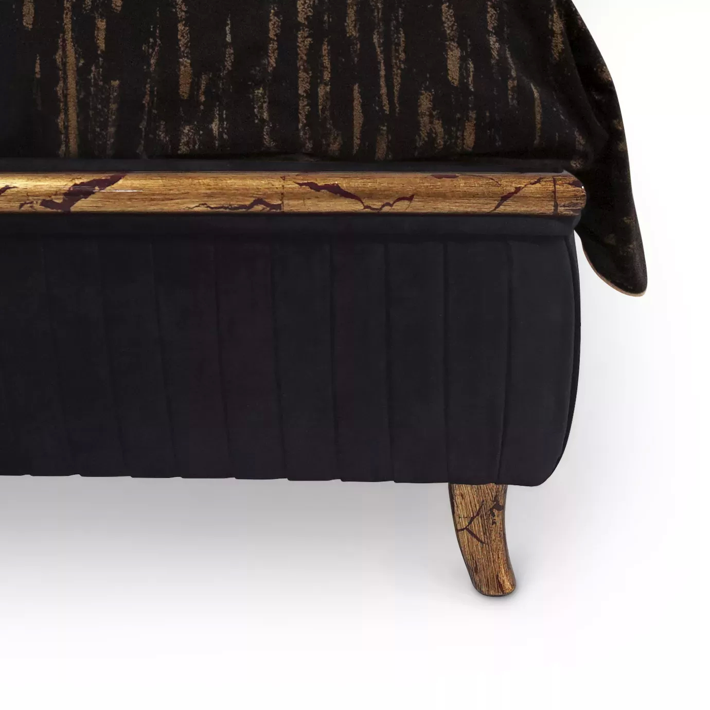 Elegant close-up of the golden frame detail with crystal applications and the black velvet upholstery of the Forbidden Bed's base.
