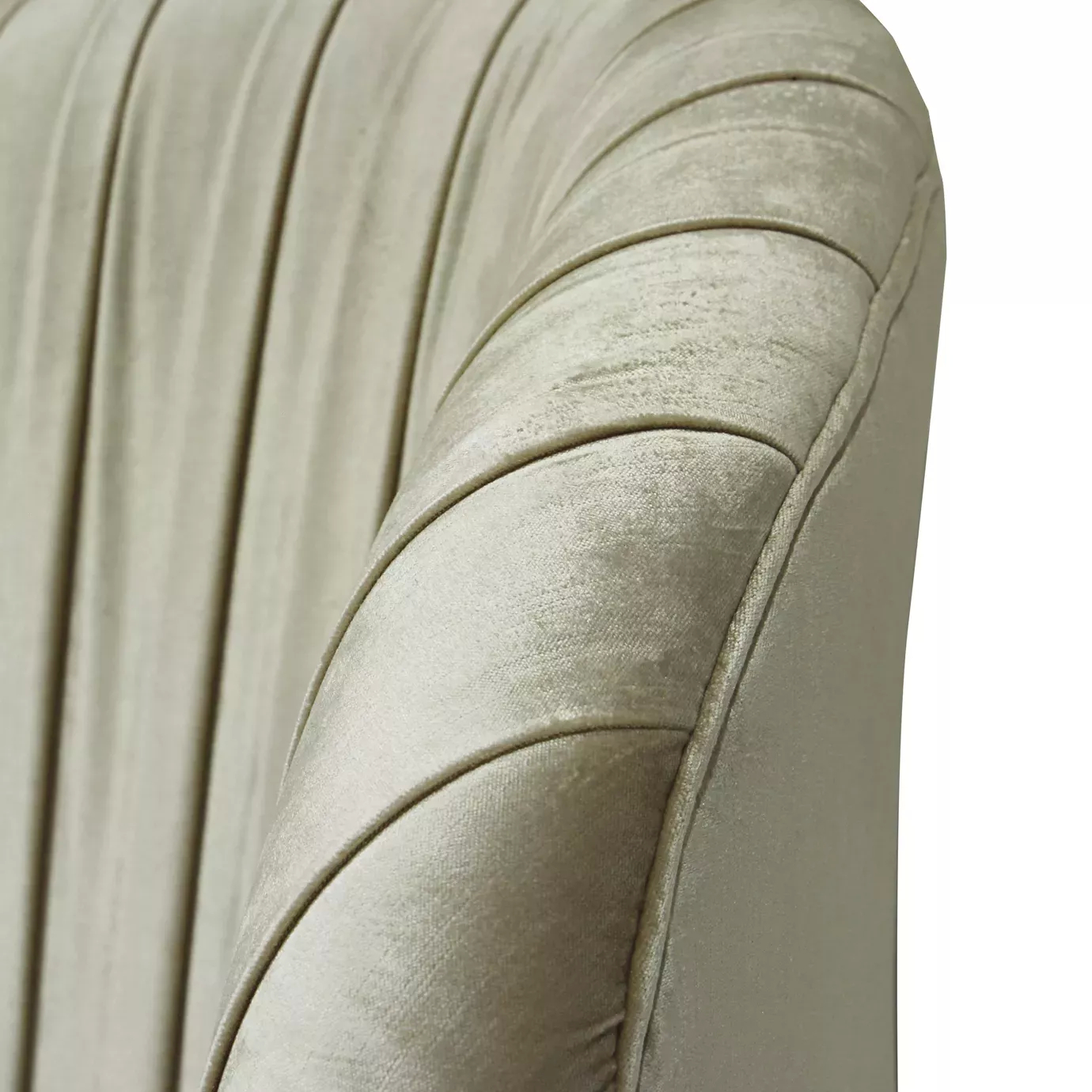 Elegant close-up of the light-toned textured fabric upholstery detail with a curved design on the headboard of the Kelly Bed.