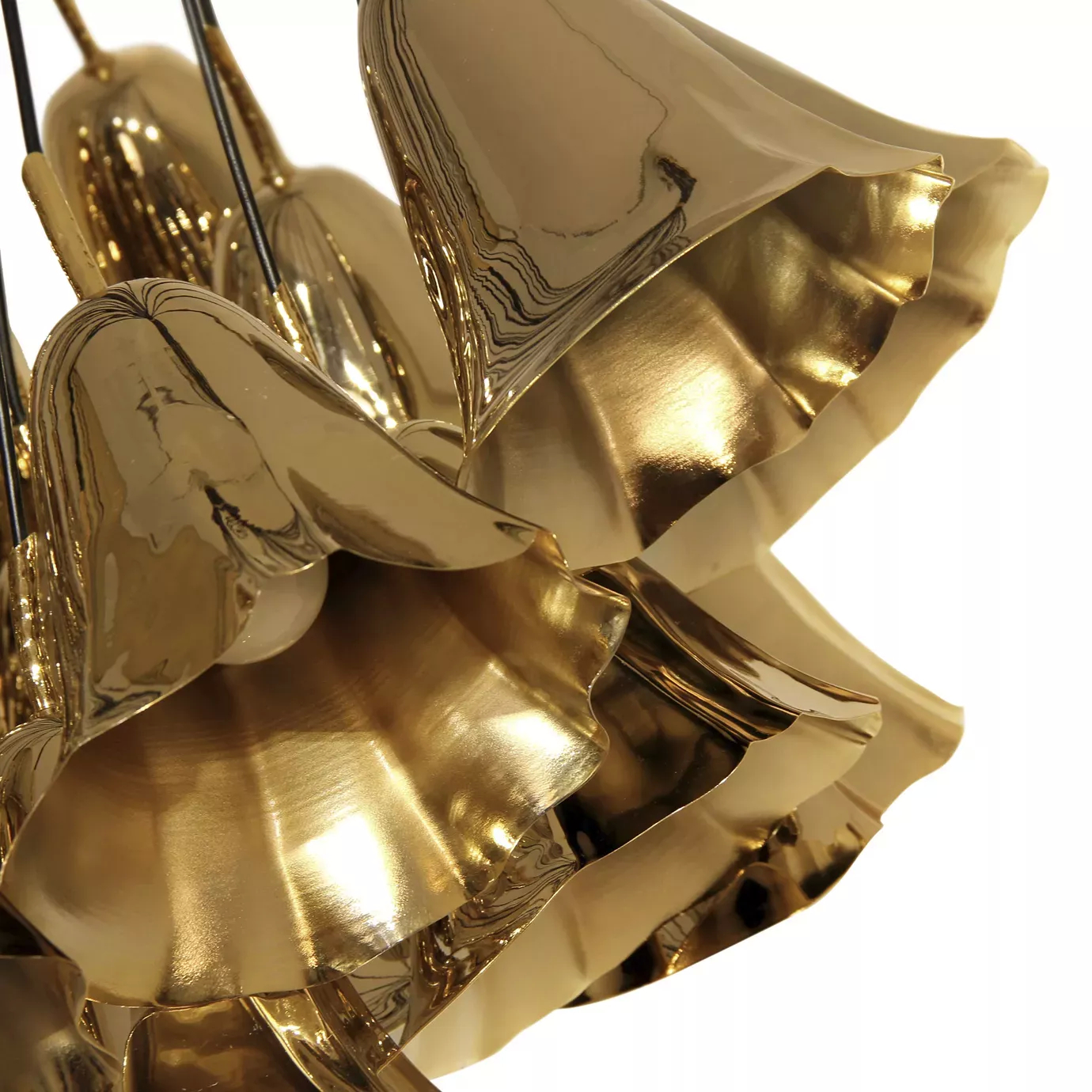 Elegant close-up of the shiny golden flower-shaped pieces detail of the Gia Chandelier.