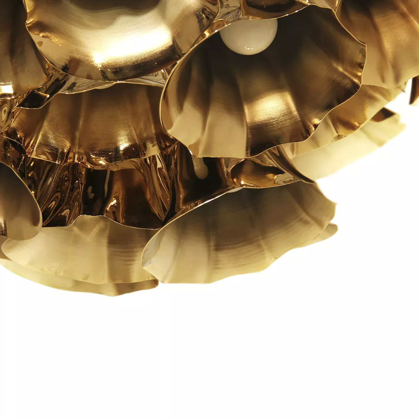 Elegant close-up of the shiny golden flower-shaped pieces detail of the Gia Chandelier.