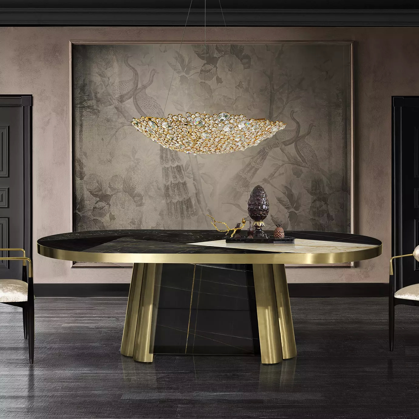 Elegant dining room with the Decodiva Dining Table featuring an oval black and white marble top and a sculptural golden base, under the Eternity Demi Lune Chandelier.