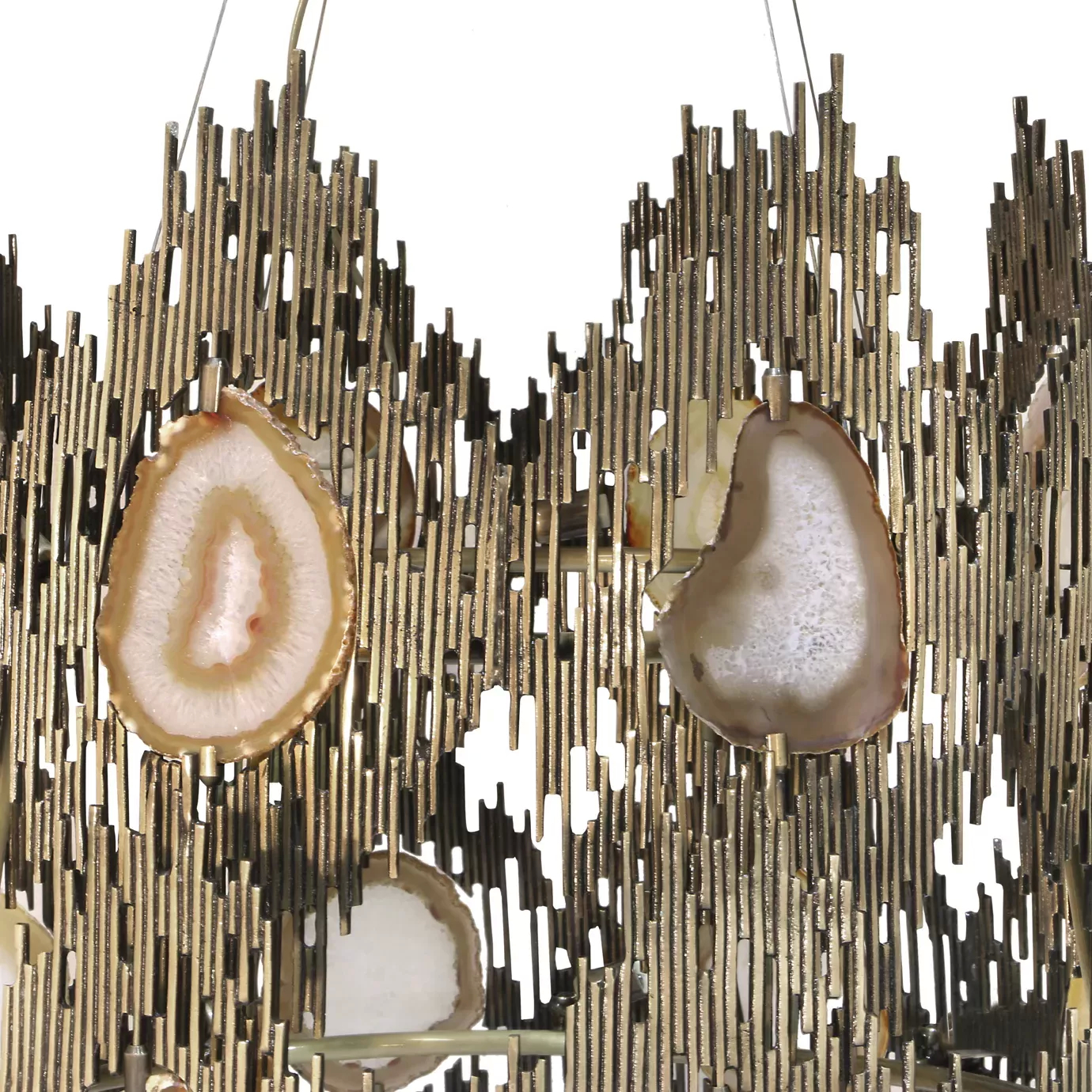 Elegant close-up of the sculptural golden frame detail with several translucent agate slices of the Vivre 2 Rings Chandelier.