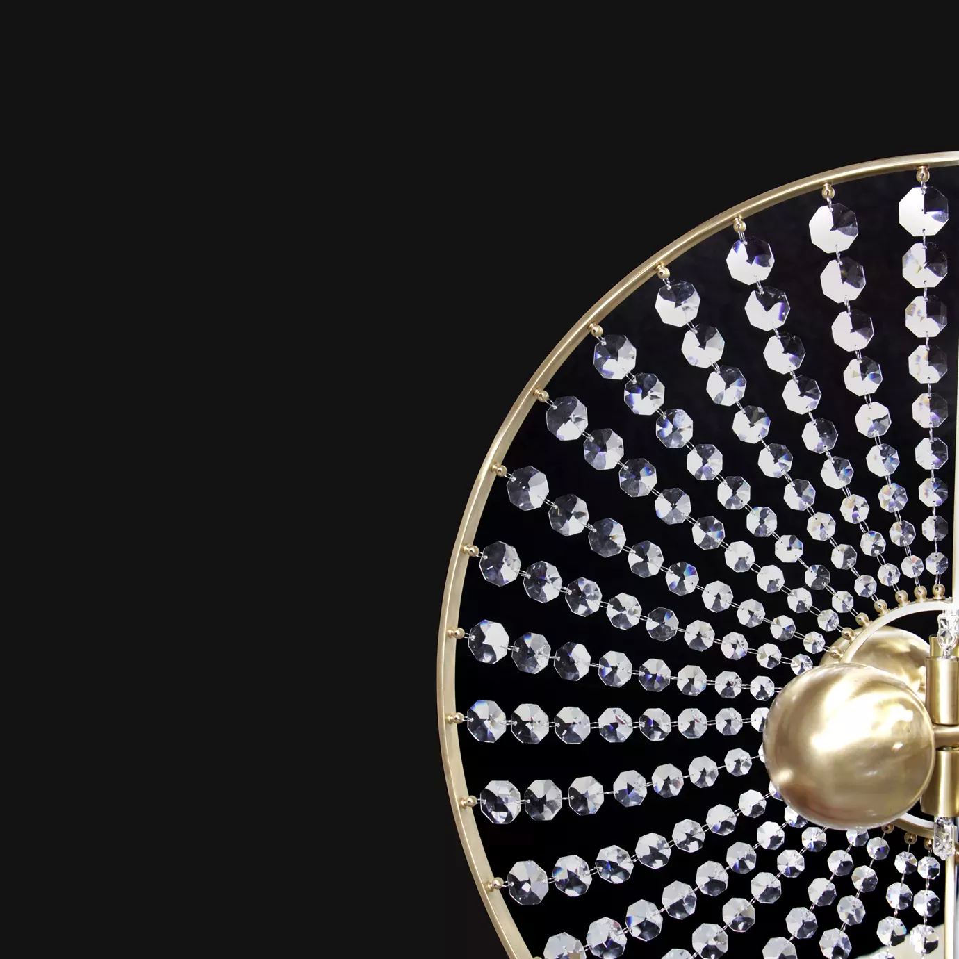 Close up of Roxy Chandelier by KOKET,  featuring crystal sunbursts and a satin brass halo