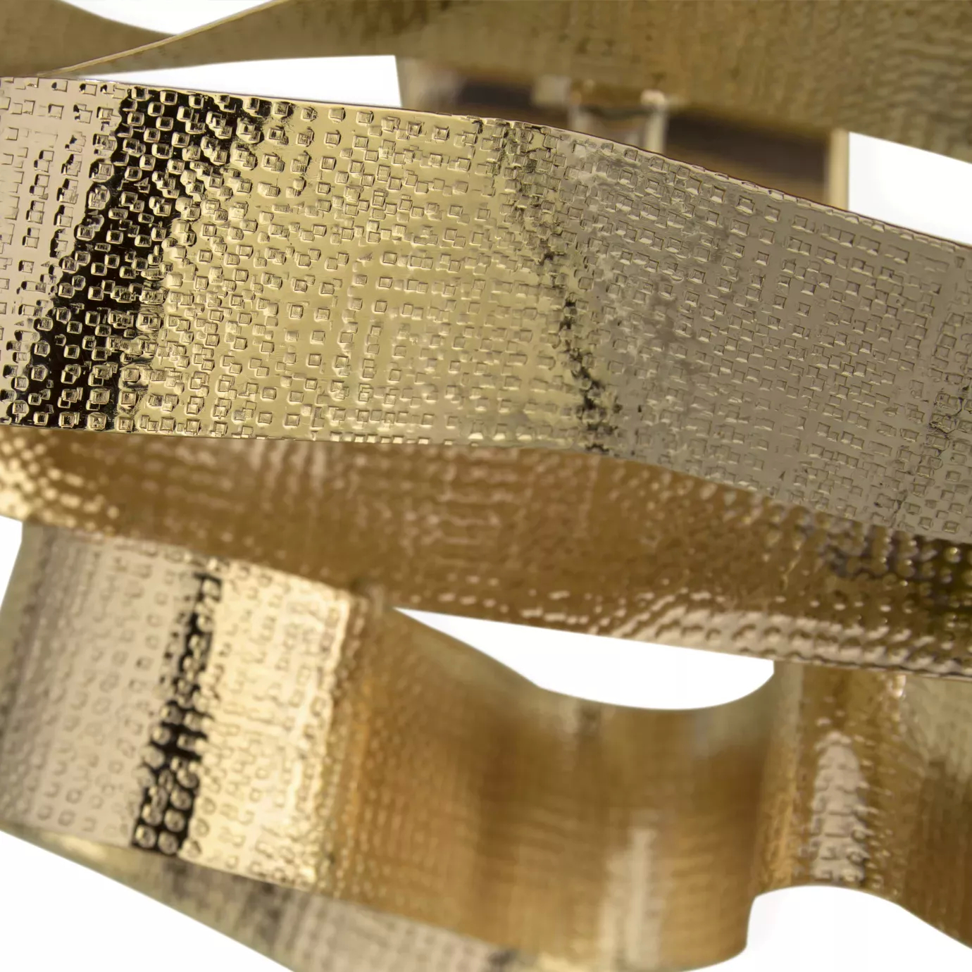 Elegant close-up of the textured golden wavy ribbons detail of the Chloe Sconce.