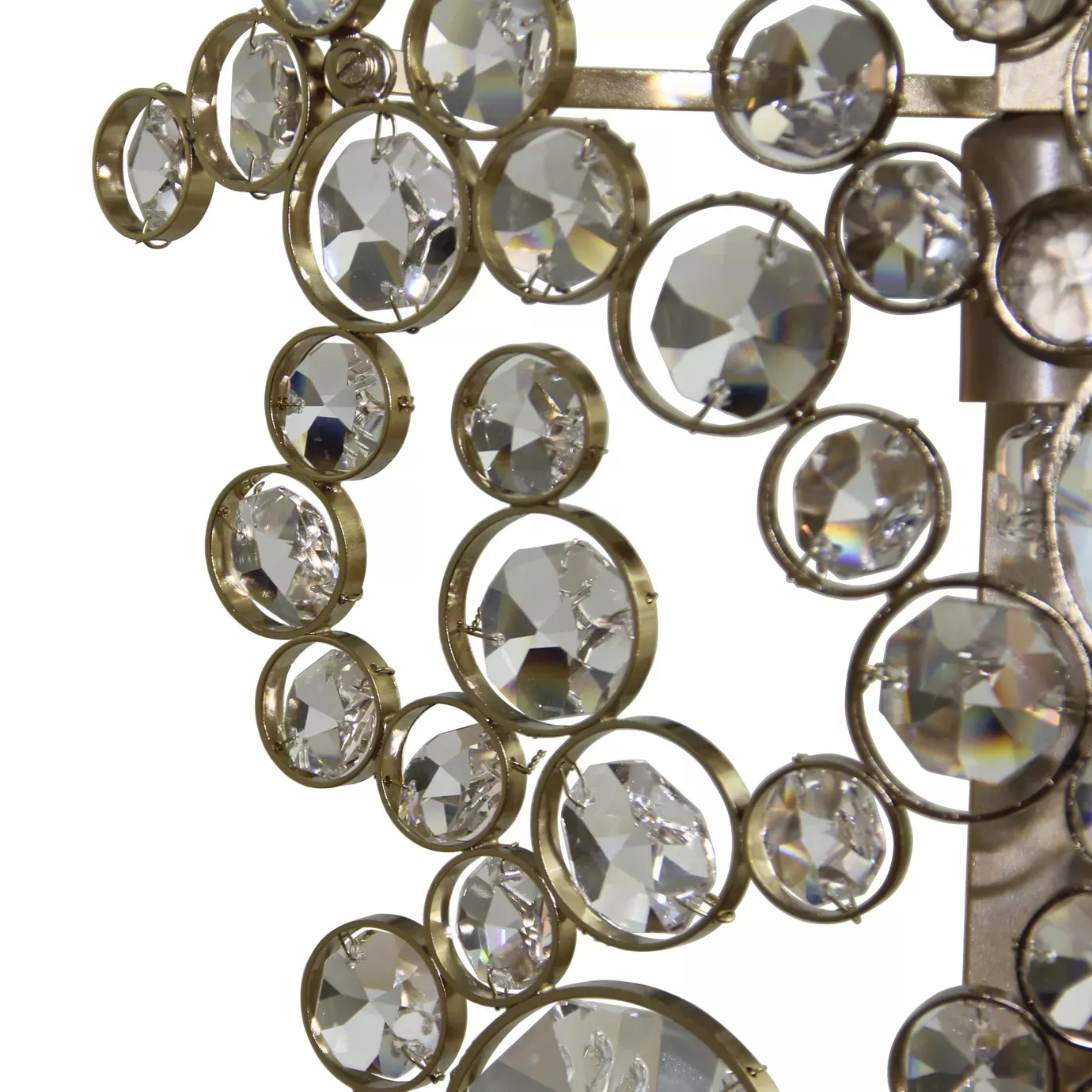 Elegant close-up of the detail of the faceted clear crystals of varying sizes fixed to the golden frame of the Eternity Clear Glass Sconce.