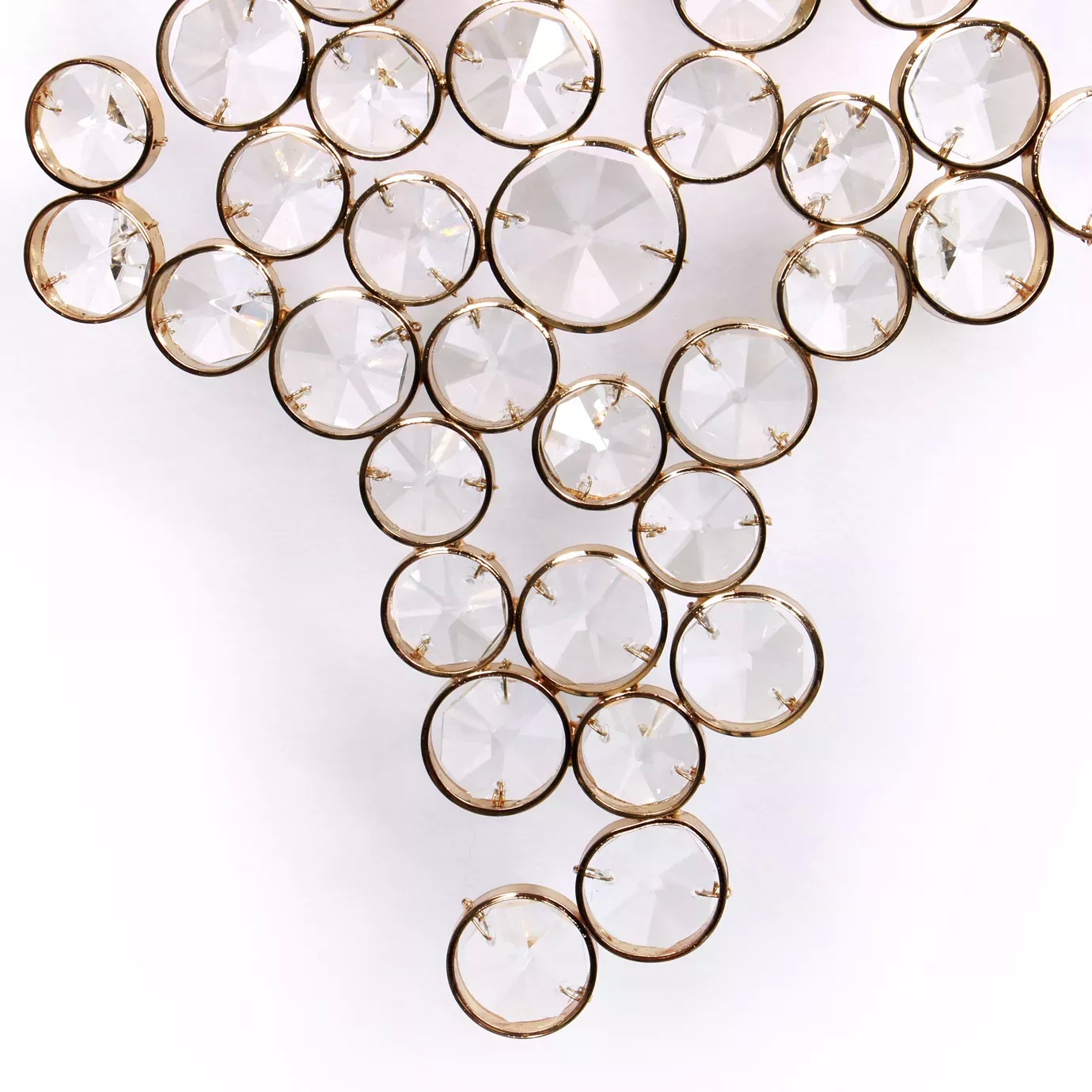 Elegant close-up of the detail of the faceted clear crystals with golden edges of the Eternity Sculpture.