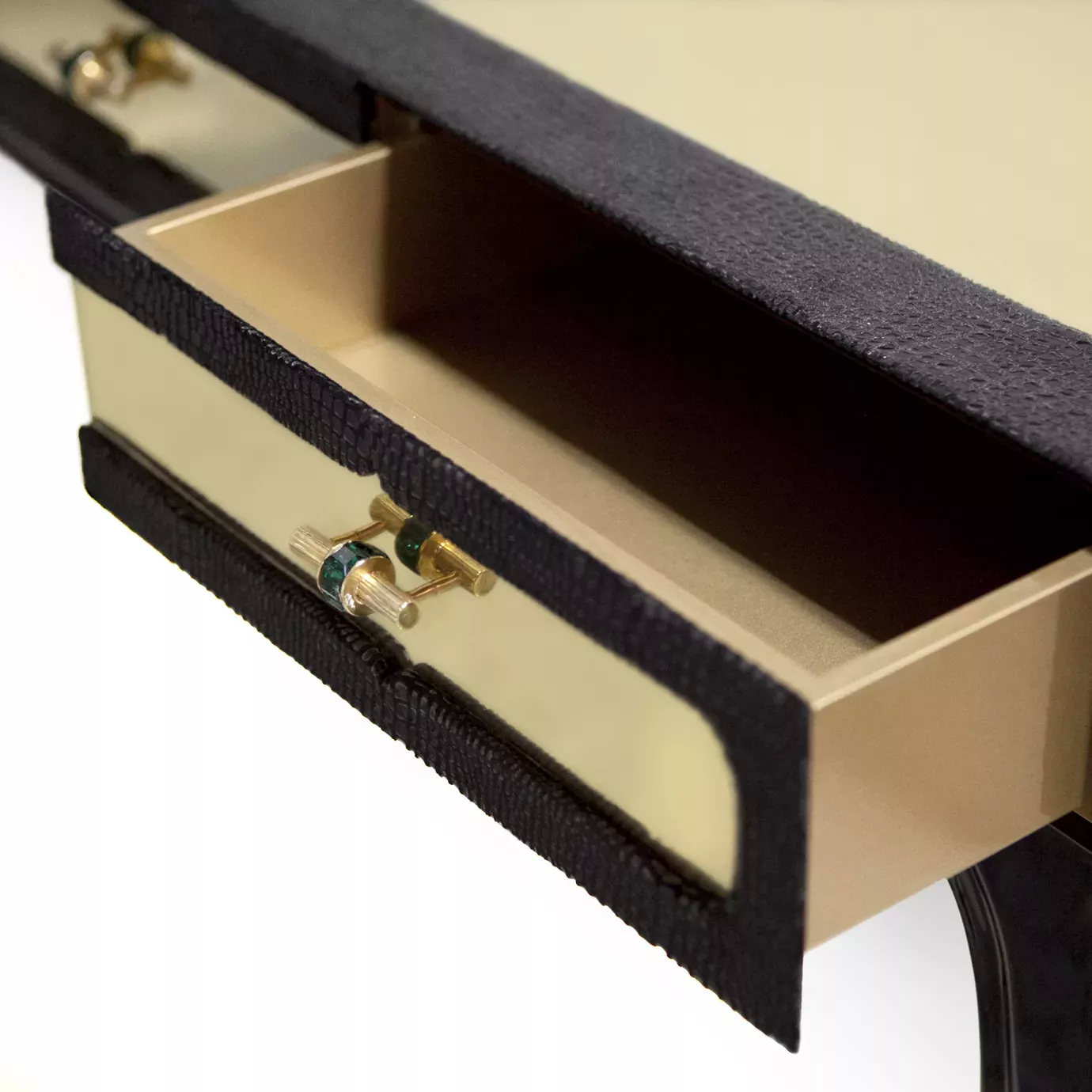 Detail of the open drawer of the Exotica Dressing Table with elegant handles.