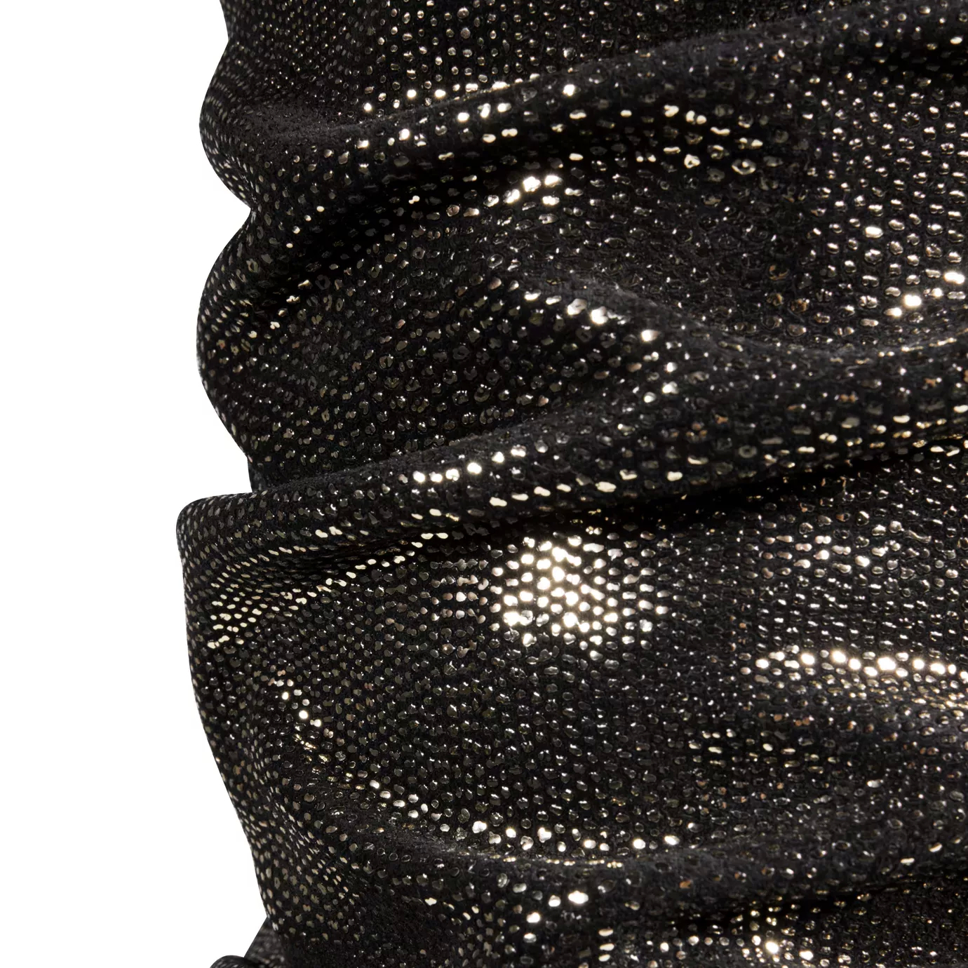 Elegant close-up of the ruched texture detail in dark brown tones with golden reflections of the body of the Ruchê Table Lamp.