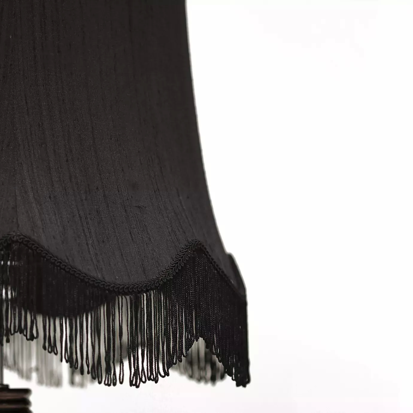 Elegant close-up of the black lampshade texture and fringe detail of the Lotus Floor Lamp.