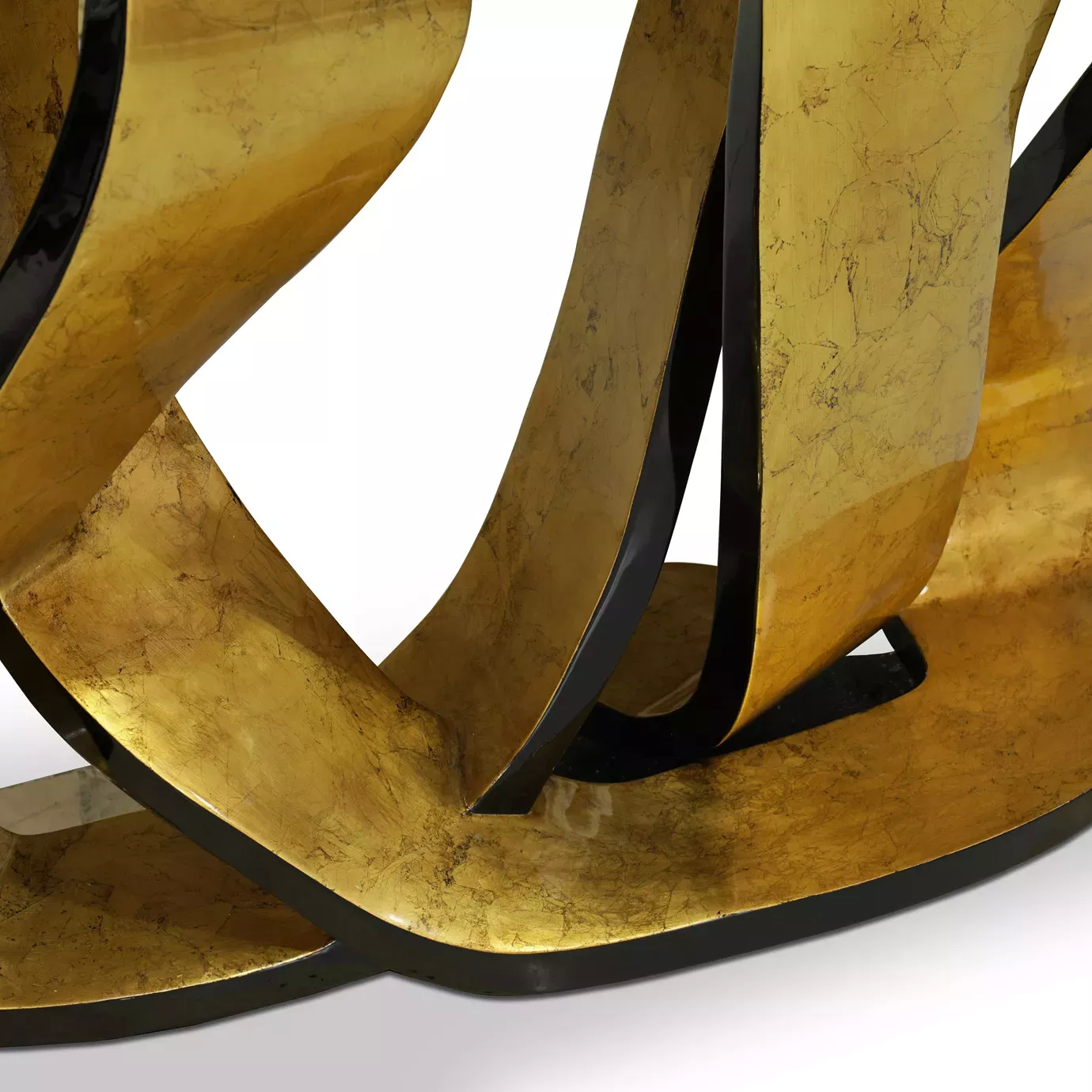 Detailed perspective of the luxurious Ribbon Broken Gold Leaf Console’s golden base, demonstrating its twists and turns.