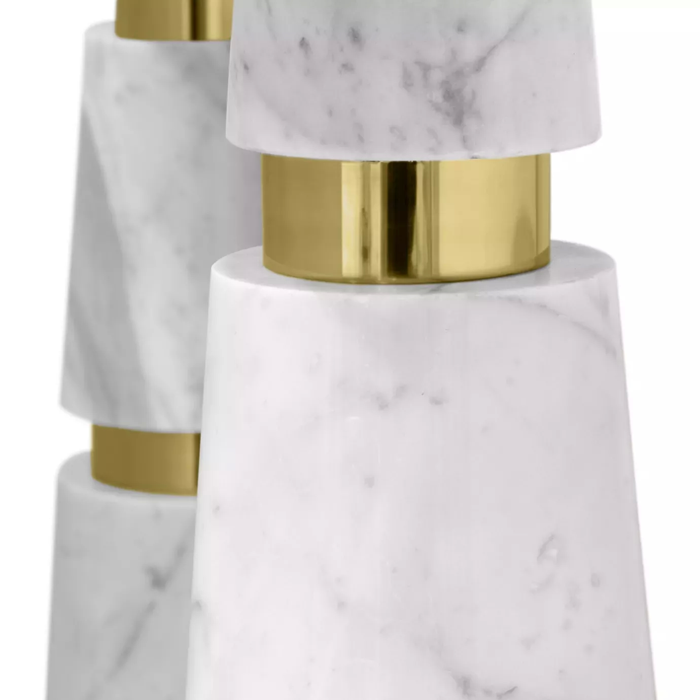 close-up of the geometric Carrara marble base with golden detail of the Avalanche Console.