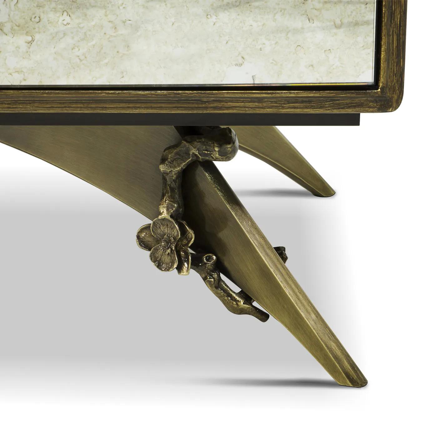 Detailed view of the feet of the Spellbound Aged Mirror Cabinet, showcasing its golden details with the same floral motifs as placed on the doors.
