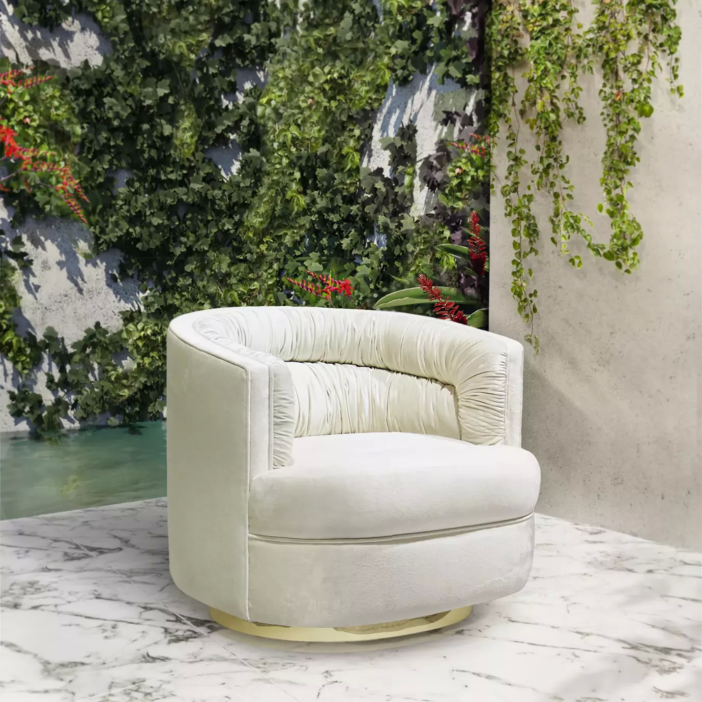 Elegant Cocktail Armchair with a golden metal base and soft white fabric upholstery featuring ruched details on the inner backrest, on a white marble floor with grey veins and against a wall with a lush vertical garden.