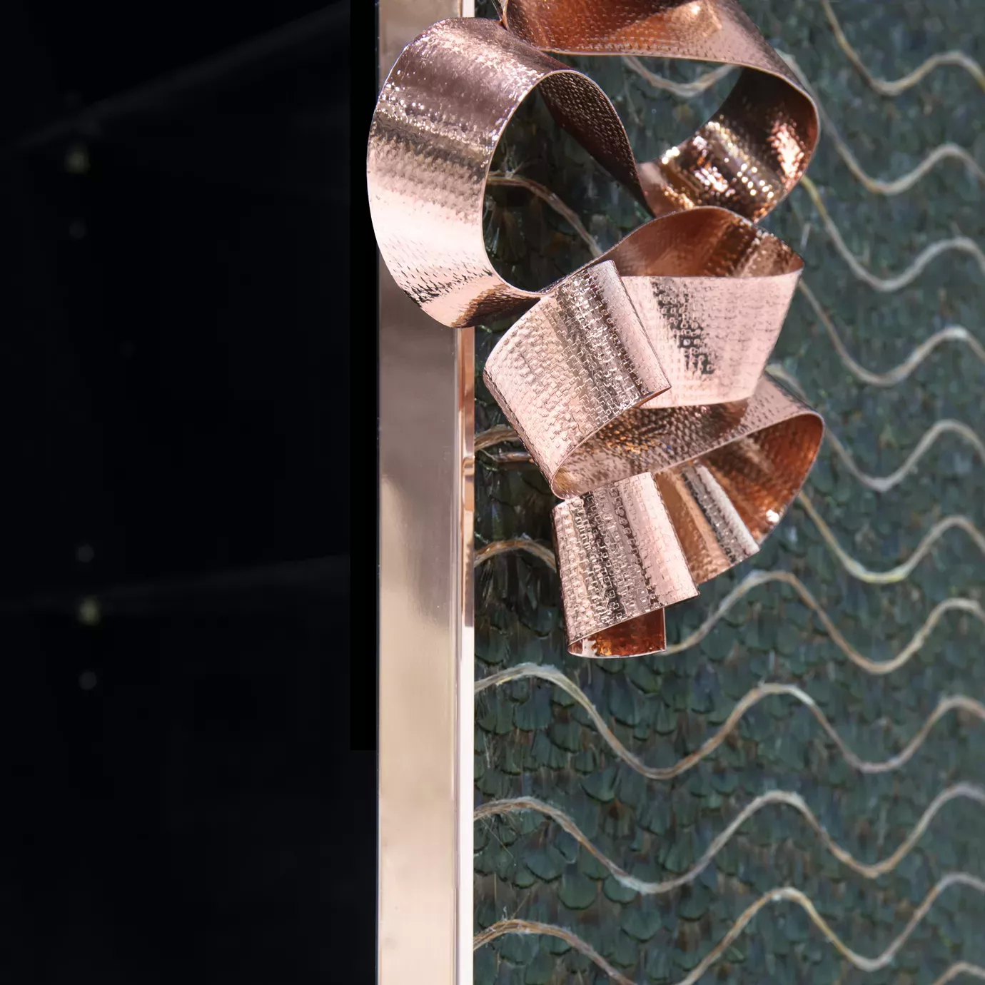 Divine Peacock Organic Feather Armoire: Detailed view of the caramel and dark green peacock feathers covered front doors and the copper ribbon handle.