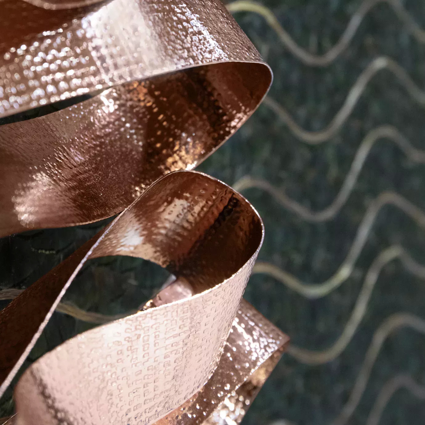 Divine Peacock Organic Feather Armoire: detailed view of the copper handle resembling a ribbon.