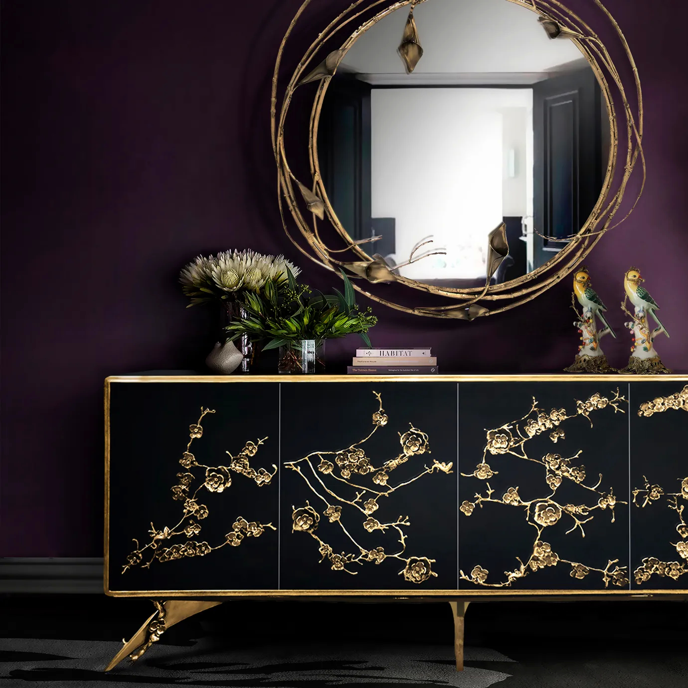 An elegant Spellbound Black Lacquer cabinet with golden floral motifs, accompanied by a copper toned mirror with intricate stem and calla lilies design.