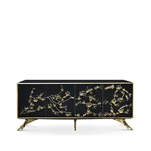 The Spellbound Lacquer Cabinet features a black structure adorned with a golden frame and elegant golden flower-shaped details along its four front doors.