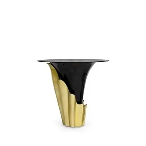 Yasmine Bar Table features a sultry silhouette with a smoked glass tabletop set on a black solid wooden base, adorned with a golden structure that arches back and forth.