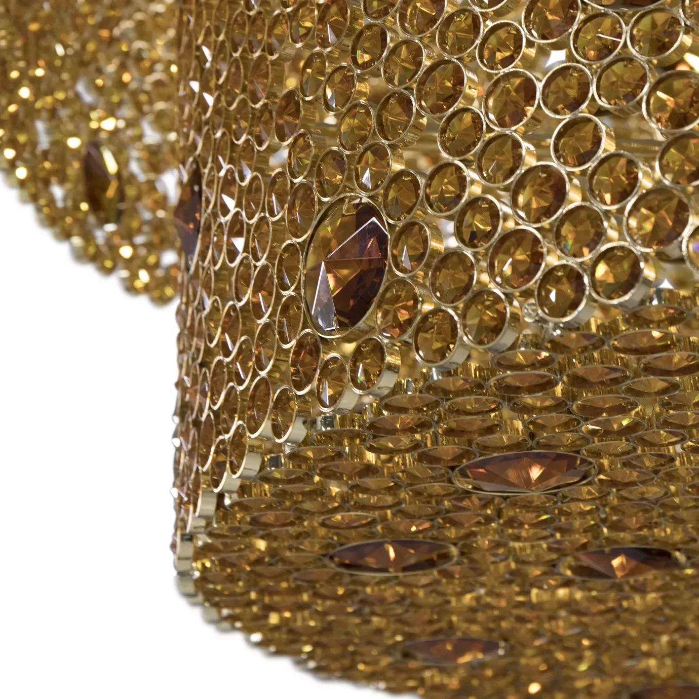 Elegant close-up detail of the golden frame and the numerous amber glass details of the Eternity three-tier chandelier.