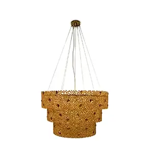 Elegant Eternity 3 Tier Chandelier with a golden frame adorned with numerous amber glass details, suspended by thin cables from a round golden ceiling mount.