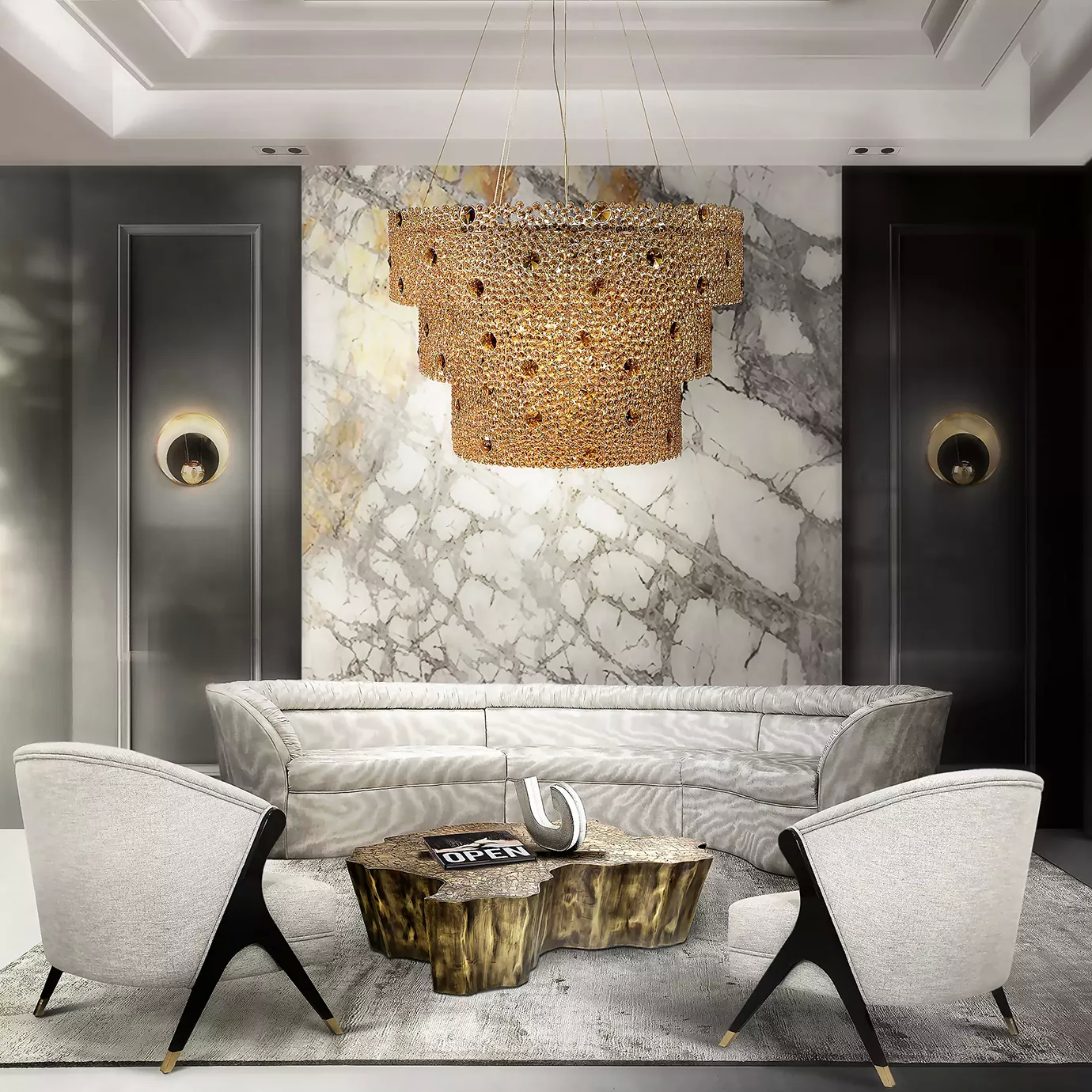 Elegant living room featuring the Eternity three-tier chandelier as a centerpiece, illuminating a soft pink Sofa, a textured wooden coffee table with golden accents, and two armchairs with light upholstery and black and gold details, on a light grey rug with a subtle pattern, against a wall with white and grey marble panels and dark grey side panels, adorned with two golden sconces with black details.