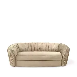 Elegant Luscious Sofa with a curved design and soft beige fabric upholstery featuring vertical pleated details on the arms and backrest.